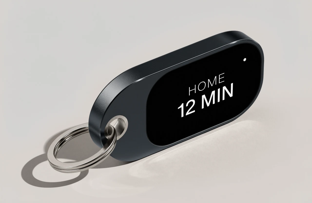 Black Last Stretch OLED concept with a split key ring and illustrative HOME 12 MIN screen.